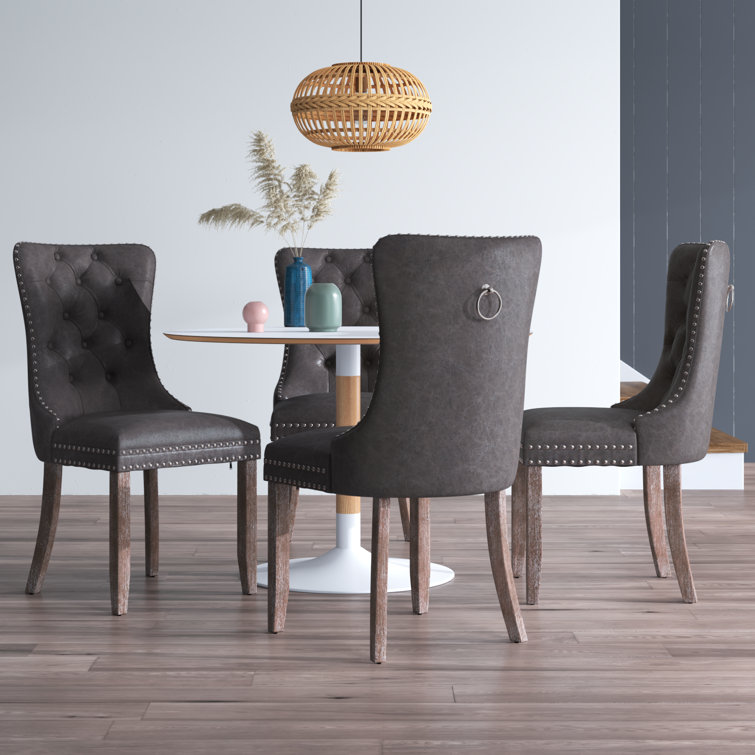 Lark Manor Alexes Tufted Leather Upholstered Wing Back Dining Chair